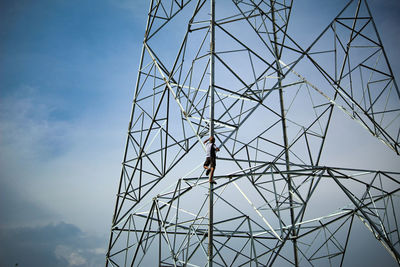 Low angle view of man against sky