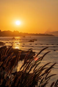 Scenic view of river against sky during sunset. sand extraction, sand suction boats.