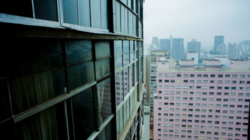 Modern buildings against clear sky in city