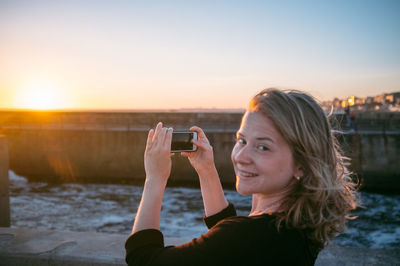 Woman looking at sunset