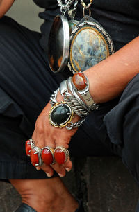 Low section of woman holding hands
