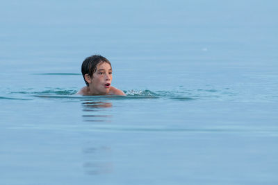 Man swimming in pool