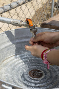 Hands open for drinking tap water. pouring fresh healthy drink. good habit. right choice. 