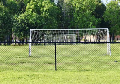 View of soccer field against trees