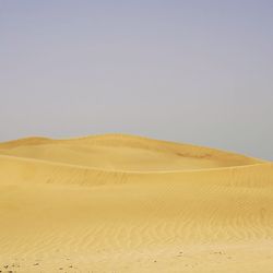 Scenic view of desert against clear sky