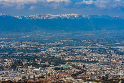 High angle view of illuminated city against sky