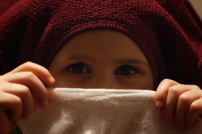 Close-up portrait of girl covering face