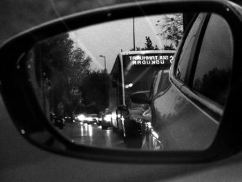 Reflection of car in side-view mirror