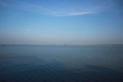 Scenic view of sea against blue sky