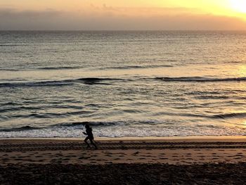 Running at sunrise on the atlantic shore