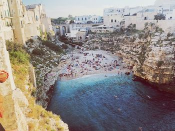 High angle view of buildings by sea