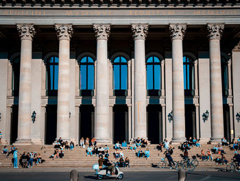 Group of people in front of historical building