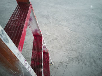 High angle view of text on wet footpath