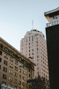 Low angle view of skyscrapers against clear sky