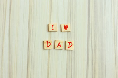 Directly above shot of wooden letter blocks on table