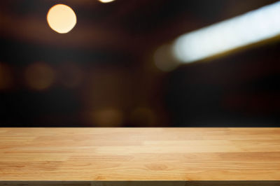 Close-up of illuminated lighting equipment on table