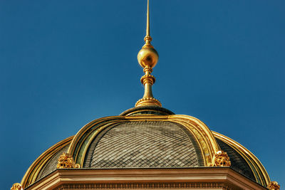 Low angle view of ornate building against clear blue sky