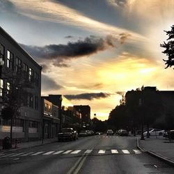 View of city street at sunset