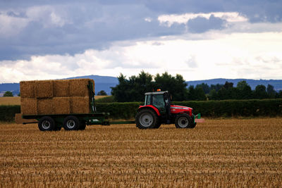 Tractor on field against sky