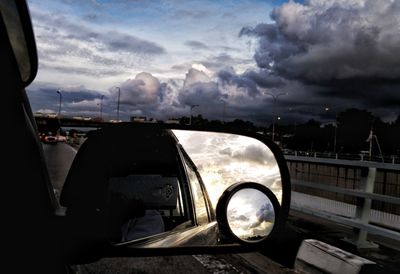 Reflection of sky on side-view mirror