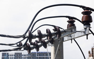 Low angle view of chain against sky