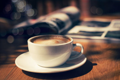 Close-up of coffee cup on table