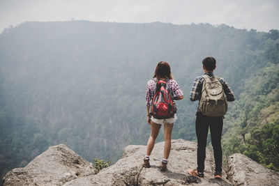 Rear view of women standing on mountain