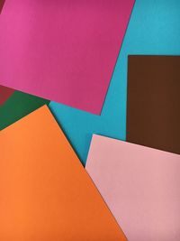 Directly view of colorful paper on table