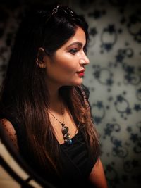 Portrait of young woman looking away