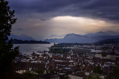 Cityscape against cloudy sky