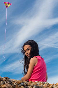 Low angle view of woman against sky