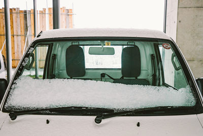 Close-up of snow covered car