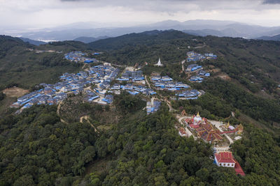 High angle view of trees and mountains against sky