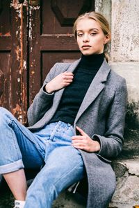 Portrait of young woman using mobile phone