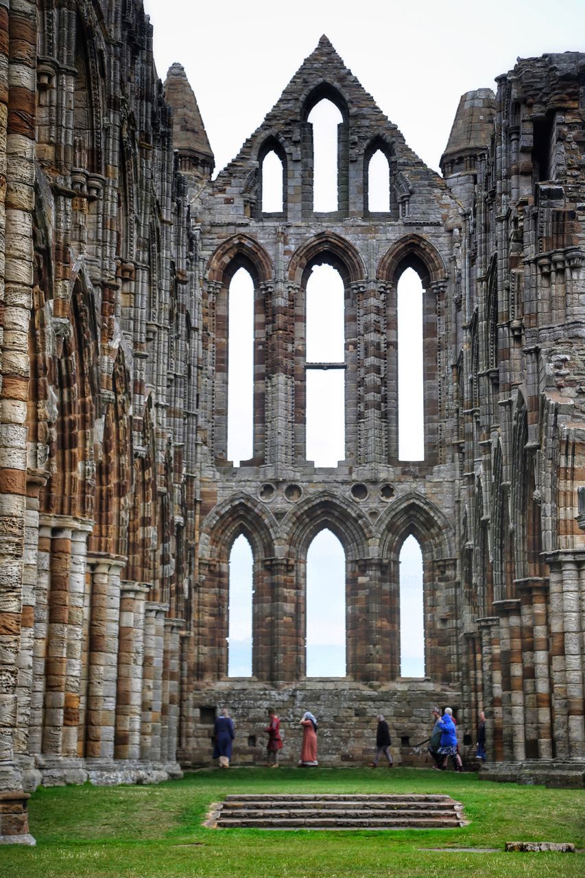 PEOPLE IN FRONT OF OLD RUIN