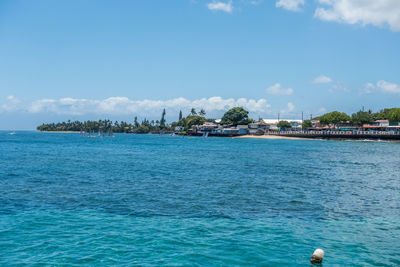 Scenic view of sea against blue sky