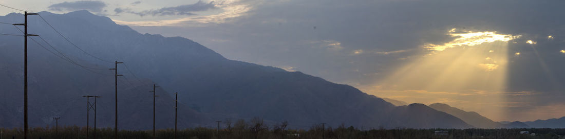 Panoramic view of mountains against sky during sunset