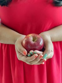 Close-up of hand holding apple