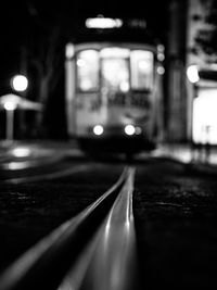 View of illuminated railroad tracks at night