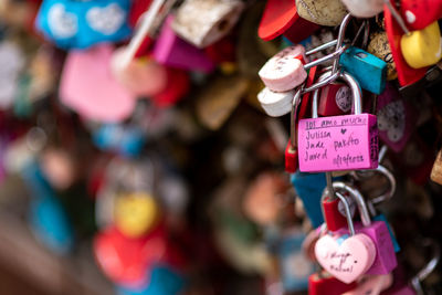 Close-up of padlocks hanging on railing