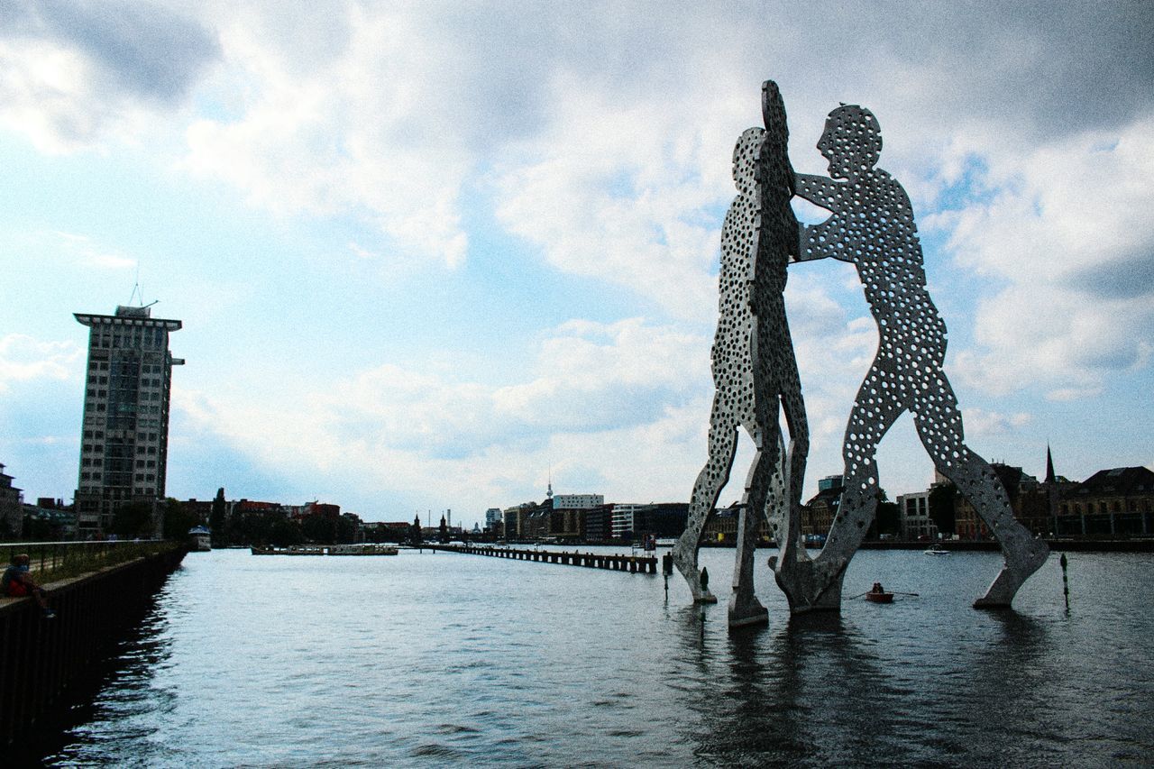 water, sky, waterfront, built structure, cloud - sky, art, cloud, cloudy, outdoors, travel destinations, day, rippled, no people, nature, tranquility, tourism