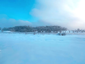 Scenic view of frozen lake against sky