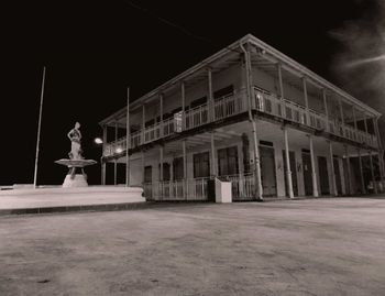 Statue of building against sky at night