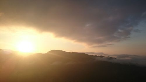 Scenic view of mountains against sky during sunset