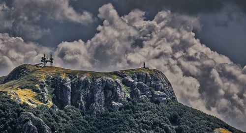 Low angle view of rock formations against sky