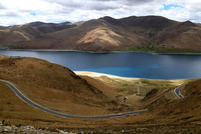 Calm lake along rocky landscape