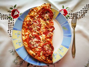 Directly above shot of pizza in plate on table