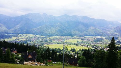 Scenic view of landscape and mountains against sky