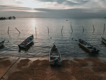 High angle view of boats moored on sea against sky