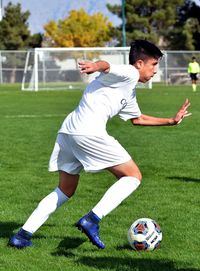 Man playing soccer on field